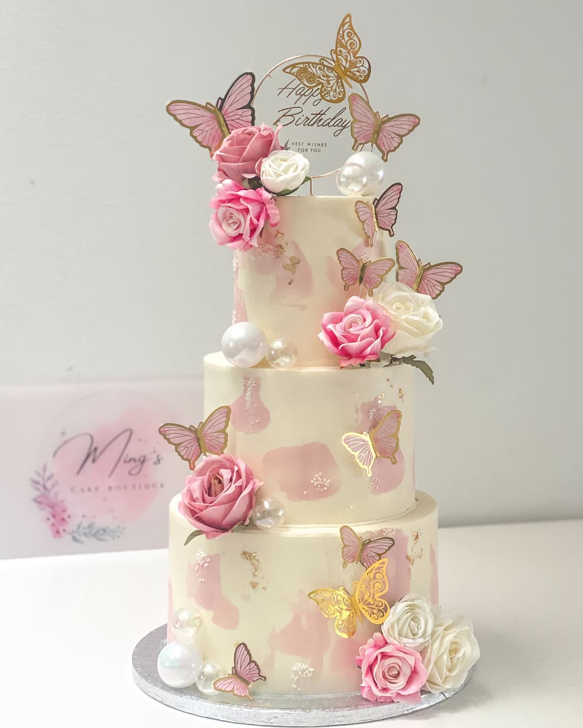 Two-tier buttercream birthday cake with pink roses and butterflies — Ming's Cake Boutique